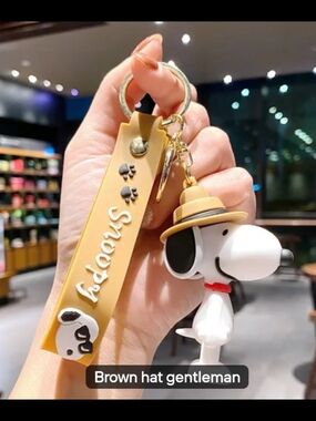 Snoopy Keychain with Tan Strap and Hat Charm